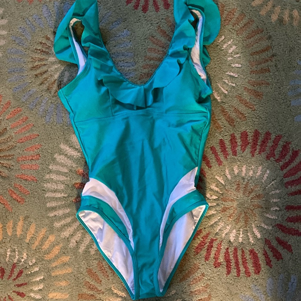 Swim suit. NWT lovely “Cupshe “ turquoise/white with ruffles at neck and back